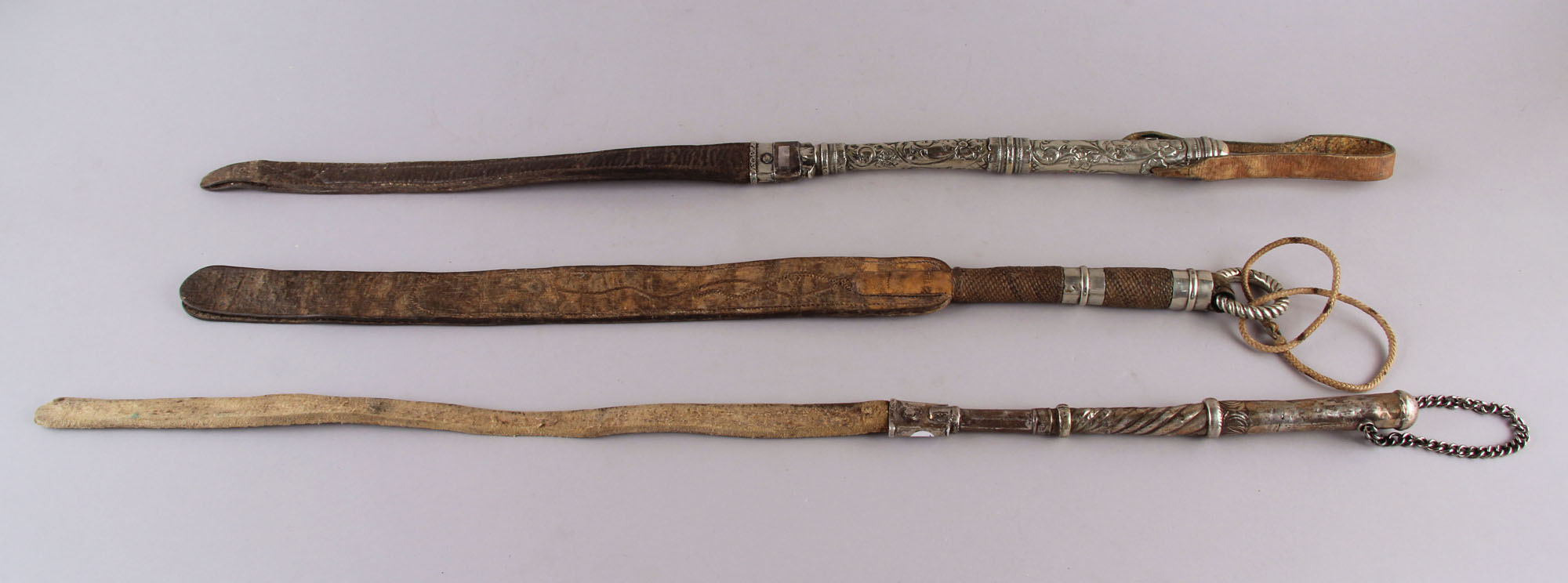 Lotes 481, 492 y 474: 
																		ANTIGUO REBENQUE CRIOLLO DEL SIGLO XIX. 
																		ANTIGUO REBENQUE CRIOLLO DEL SIGLO XIX. 
																		ANTIGUO REBENQUE ESTILO PAMPA DEL SIGLO XIX.